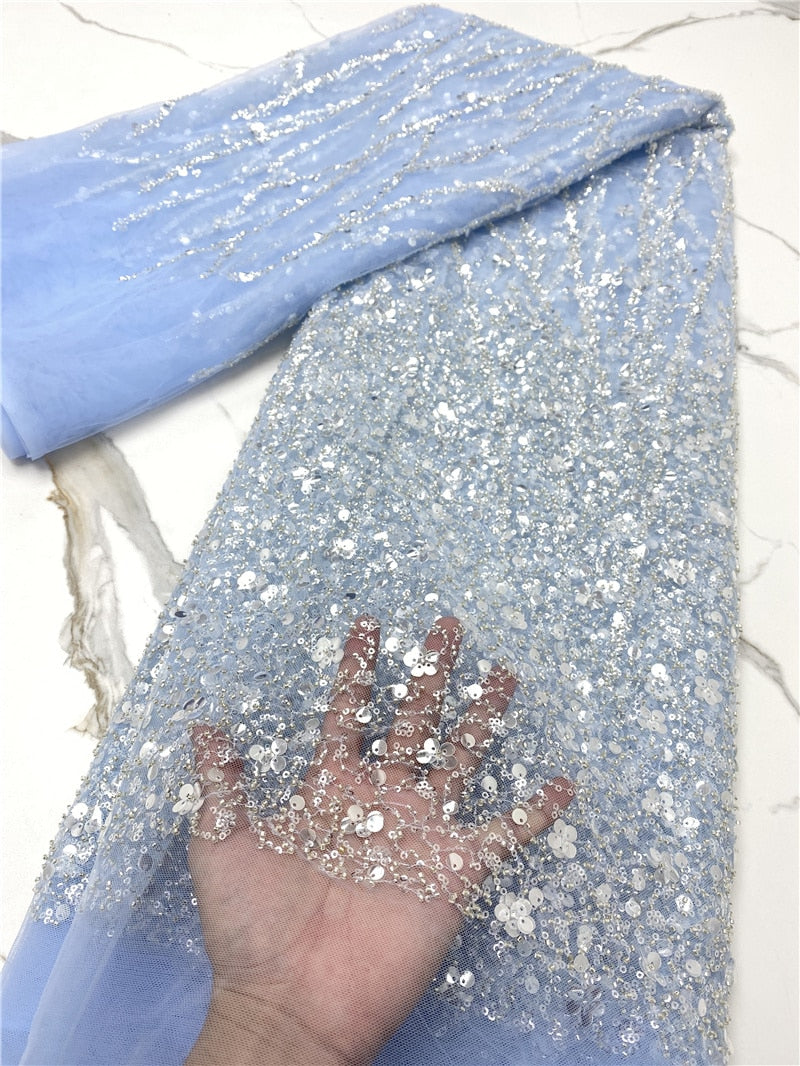 💎 French Lace With Beads and Sequins – 5 Yards Luxury Embellished Fabric for Bridal & Occasion Wear
Turn heads with this elegant French Lace With Beads and Sequins, a 5-yard premium fabric adorned with intricate embroidery, shimmering sequins, and hand-applied beads. This luxurious lace is perfect for creating asoebi gowns, bridal dresses, evening outfits, and reception wear that demand attention.

Soft, breathable, and richly textured, this lace drapes beautifully and adds regal sparkle to both modern and