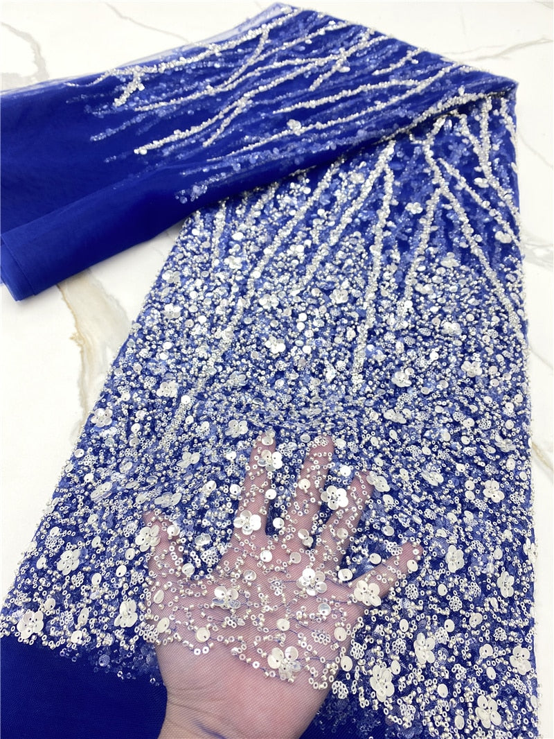  💎 French Lace With Beads and Sequins – 5 Yards Luxury Embellished Fabric for Bridal & Occasion Wear
Turn heads with this elegant French Lace With Beads and Sequins, a 5-yard premium fabric adorned with intricate embroidery, shimmering sequins, and hand-applied beads. This luxurious lace is perfect for creating asoebi gowns, bridal dresses, evening outfits, and reception wear that demand attention.

Soft, breathable, and richly textured, this lace drapes beautifully and adds regal sparkle to both modern an